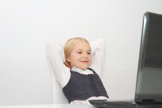 Young Girl Using Laptop At Home