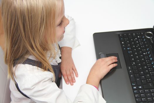 Young Girl Using Laptop At Home