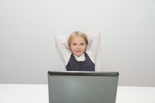 Young Girl Using Laptop At Home