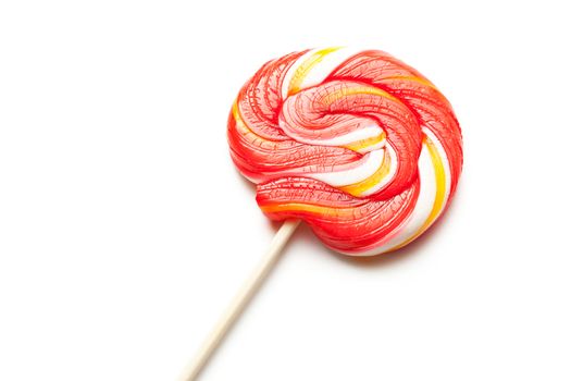 Bright lollipop candy on white background