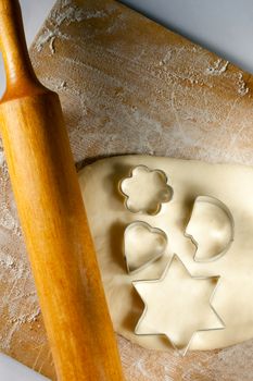 Rolling pin with dough and cookie forms