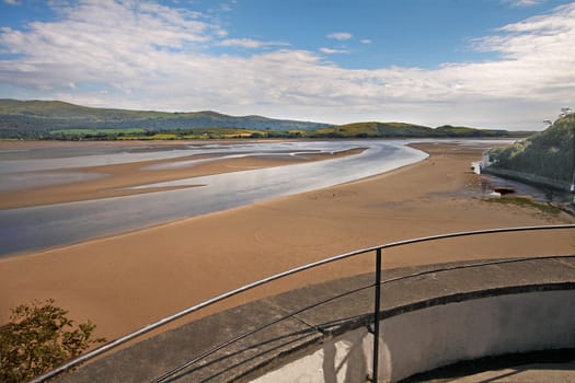 When the tide is out there is a huge beach at Portmeirion in Wales, UK.