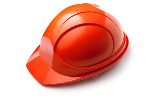 Red safety helmet on white