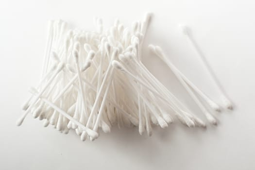 White cotton swabs on white