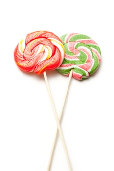 Bright lollipop candy on white background