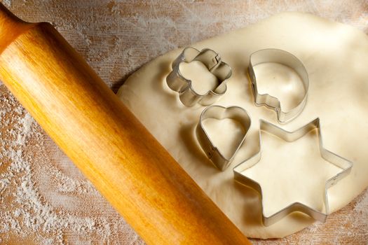 Rolling pin with dough and cookie forms