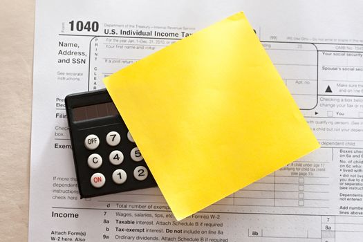 Tax form, calculator and sticker