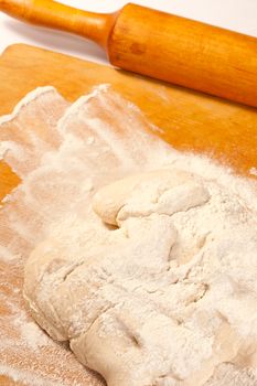 Dough in flour on breadboard