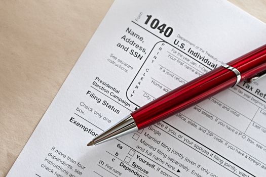 Tax form and a red pen