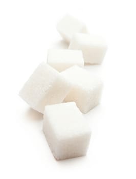 Cubes of sugar on the white background