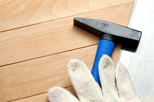 Hammer with handsaw and gloves