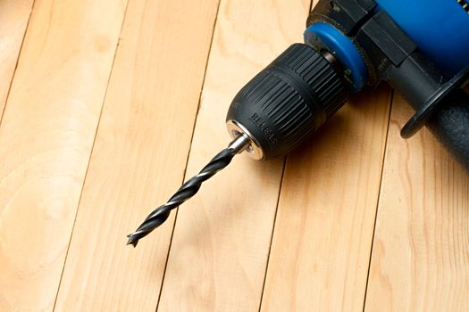 Handdrill on the wooden background