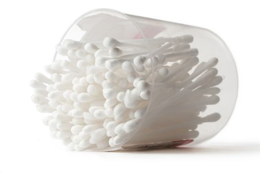 White cotton swabs in plastic container