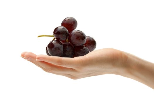 Female hand with some grapes