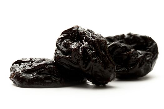 Prunes on the white background