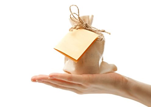 Gift sack with card in female hand