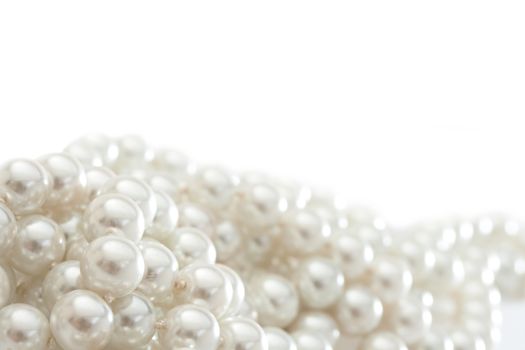 String of pearls on white