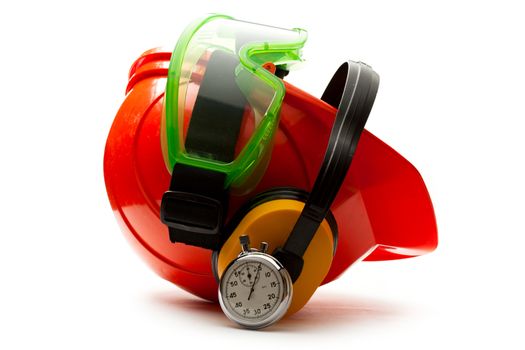 Red safety helmet with earphones, goggles and stopwatch