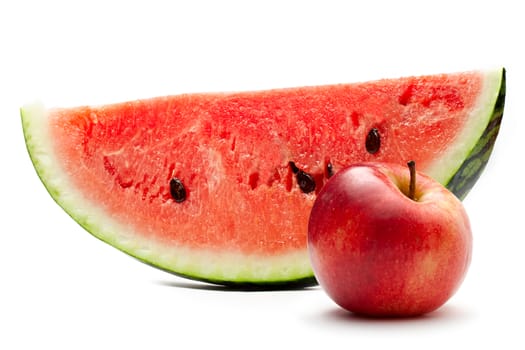 Watermelon and red apple on the white background