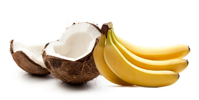 Coconut and bananas on white