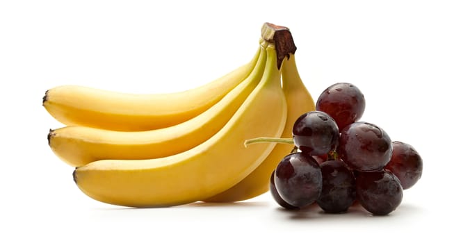 Bunch of ripe bananas and grapes