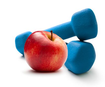 Blue dumbbells and red apple