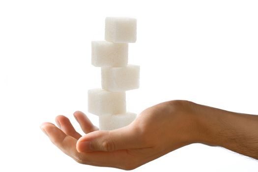 Male hand with sugar cubes