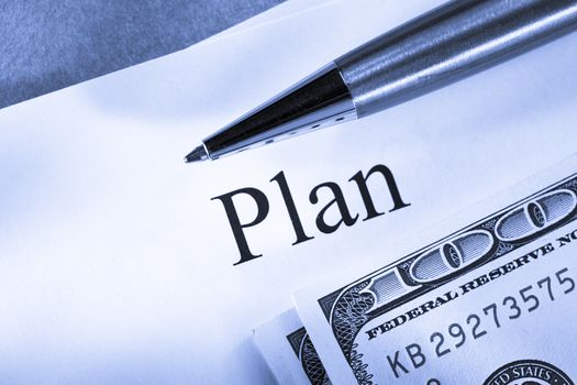 Plan conception with pen and money