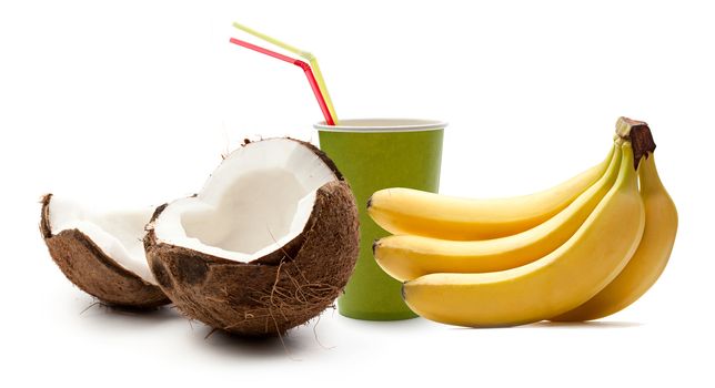 Paper cup, bananas and coconut