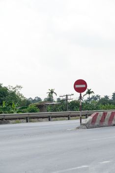 Traffic stop signs on the road to let driver beware of the barrier