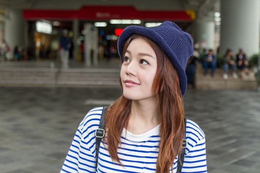 Pretty Chinese woman outside MRT subway station in Taipei