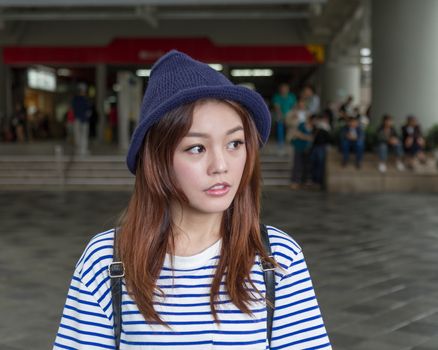 Pretty Chinese woman outside MRT subway station in Taipei