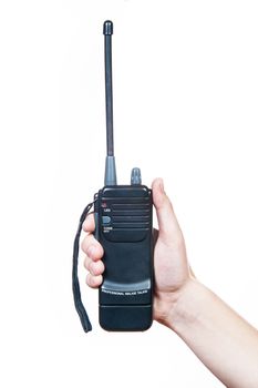 Somone holding walkie talkie in your hand. Studio image. 