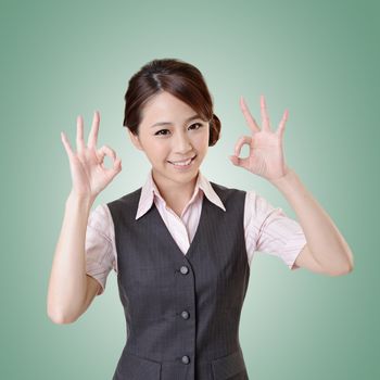 Asian business woman give you OK gesture, close up portrait with clipping path.