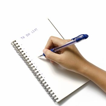 woman hand writing with pen on notebook write to do word over white background