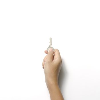 woman hand holding key on a white background