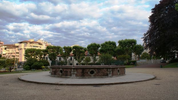 Nice square in Biarritz, France. Trees and houses are around