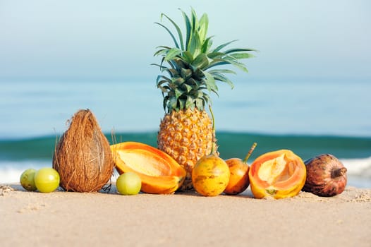 Different exotic fruits on the tropical beach