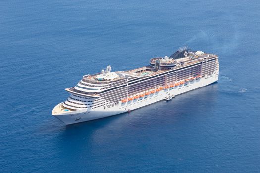 Luxury cruise ship sailing in Mediterranean sea.