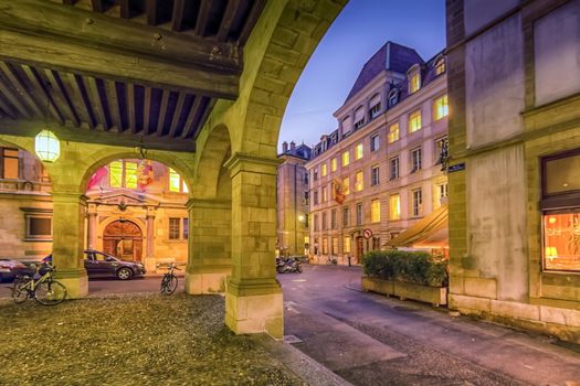 Old city street and arches by night, Geneva, Switzerland, HDR