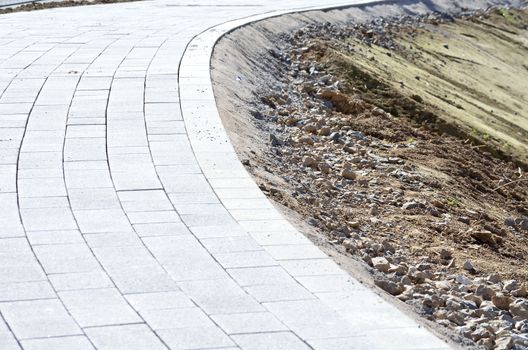 Embarrassed paving stones. The edge of a block paving floor 