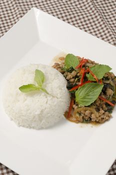 Thai main food Rice topped with stir-fried pork and basil