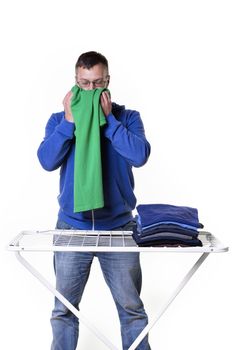 man doing housework and smells of laundry