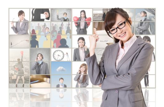 Cheerful Asian business woman standing in front of TV screen wall, closeup portrait.