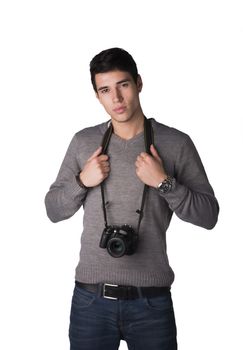 Handsome young man with professional photo camera hanging from his neck, isolated on white