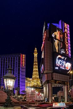 Bally's Hotel and Casino with Eiffel Tower replica in Paris by Night