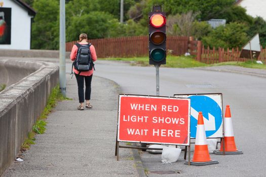 Emergency traffic light with sign at a road in Scotland