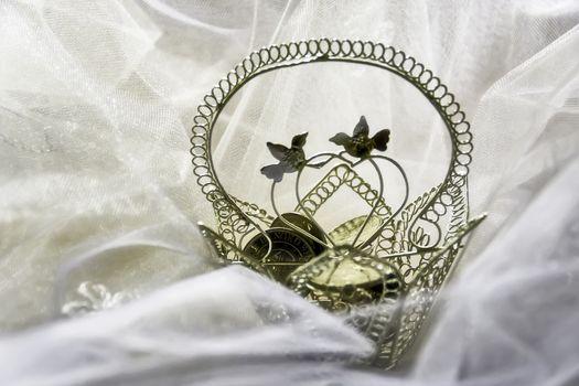 Arras and 13 coins symbolizing the groom's promise to his bride to support her and their family