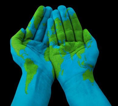 World map painted on human hands. Isolated on black background