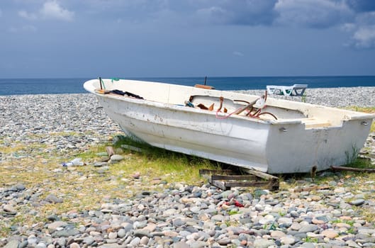 Old boat standing on the shore